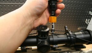 Loosening Ravin scope rings for eye relief adjustment
